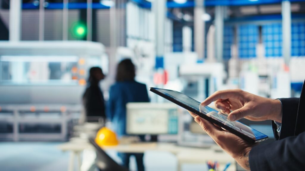 photovoltaics factory worker uses tracking software on tablet to diagnose system